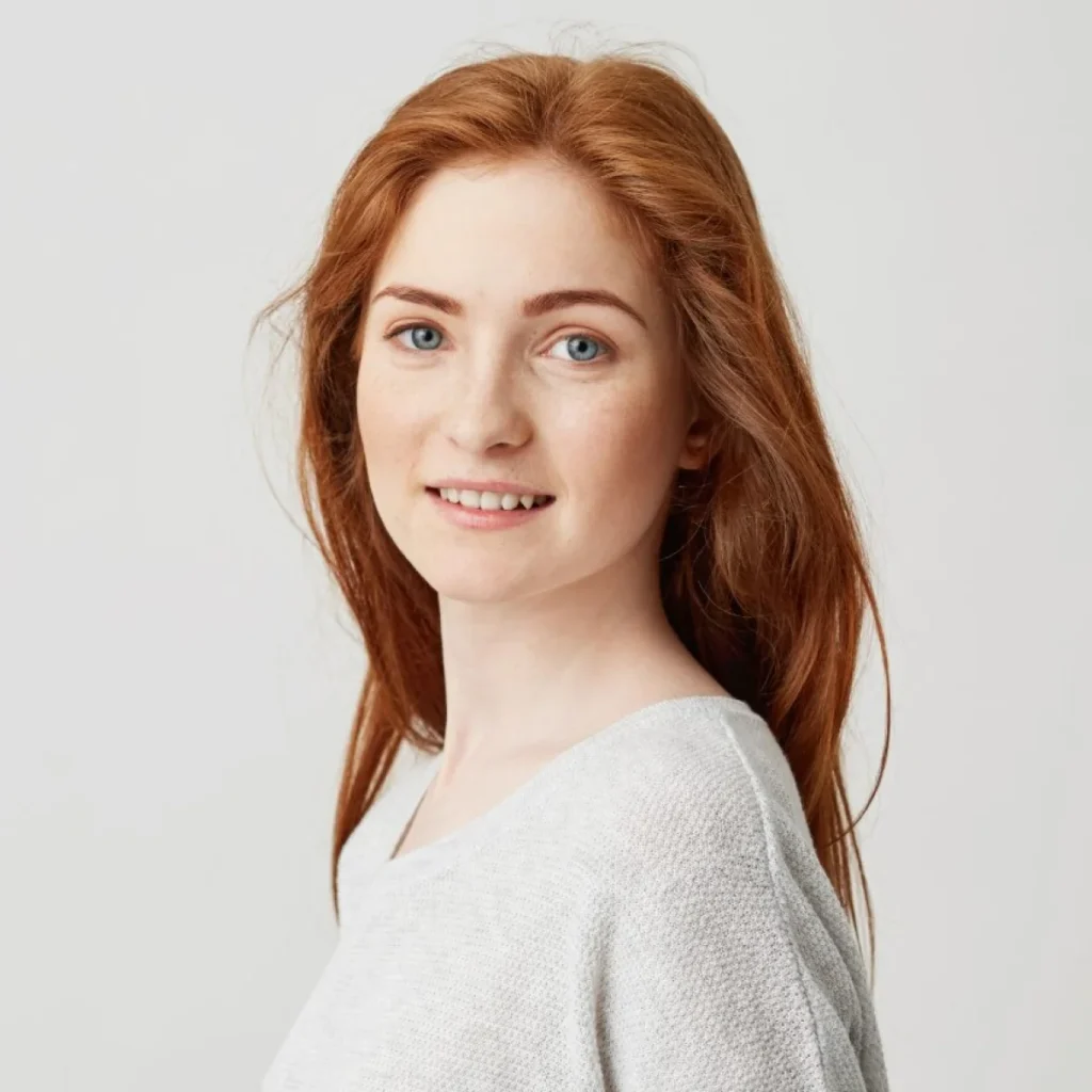 Woman with long red hair in profile view.