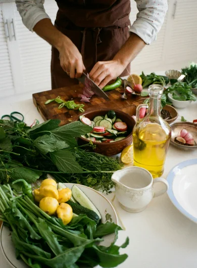 Hands chopping vegetables for a healthy meal.