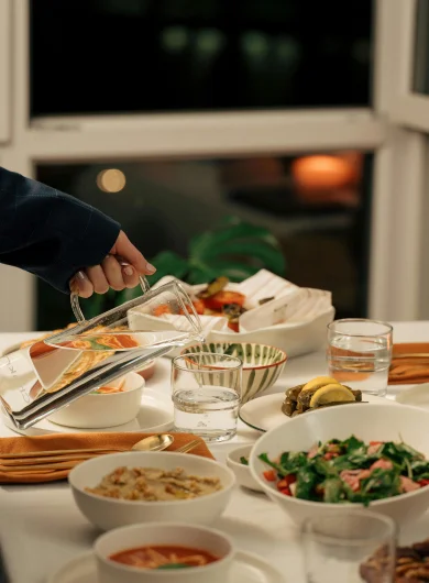 Fresh ingredients arranged on a dining table.