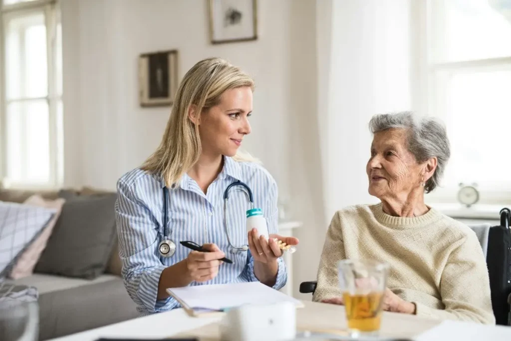 Nurse explaining medication to senior patient