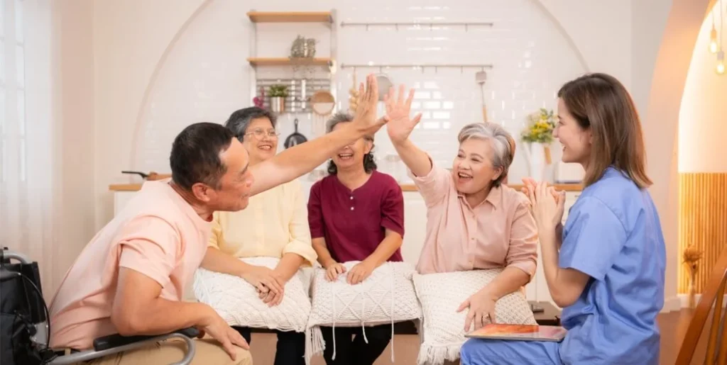 Seniors giving high-fives in a cheerful group activity.